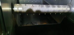 Beschichtete Stiftwalze im Brennstoff-Aufgabeschacht eines Holzheizkraftwerk.